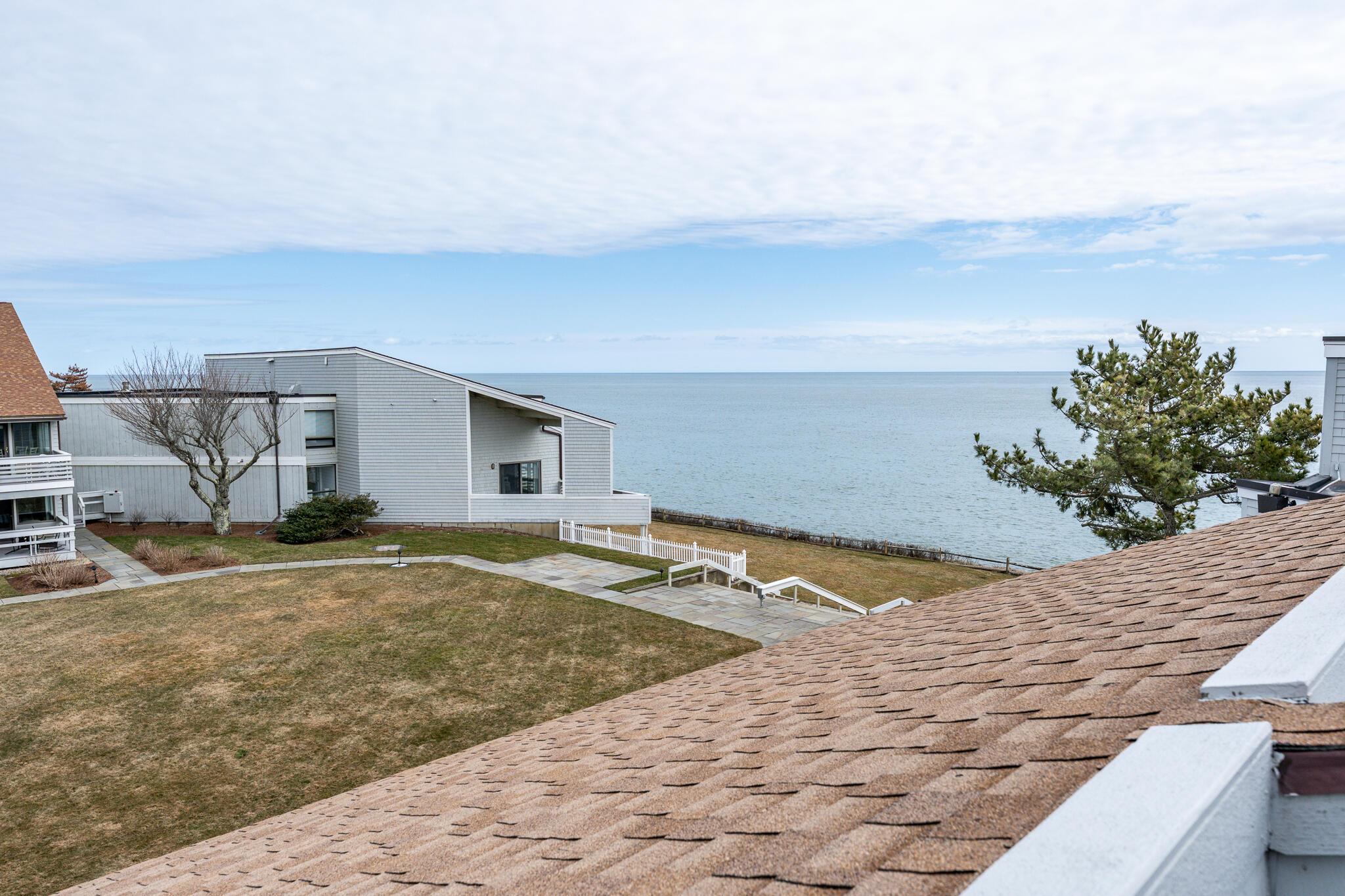 94 Shore Drive West, Unit 9B Mashpee, MA 02649 - Photo 20 of 35 a view of a backyard
