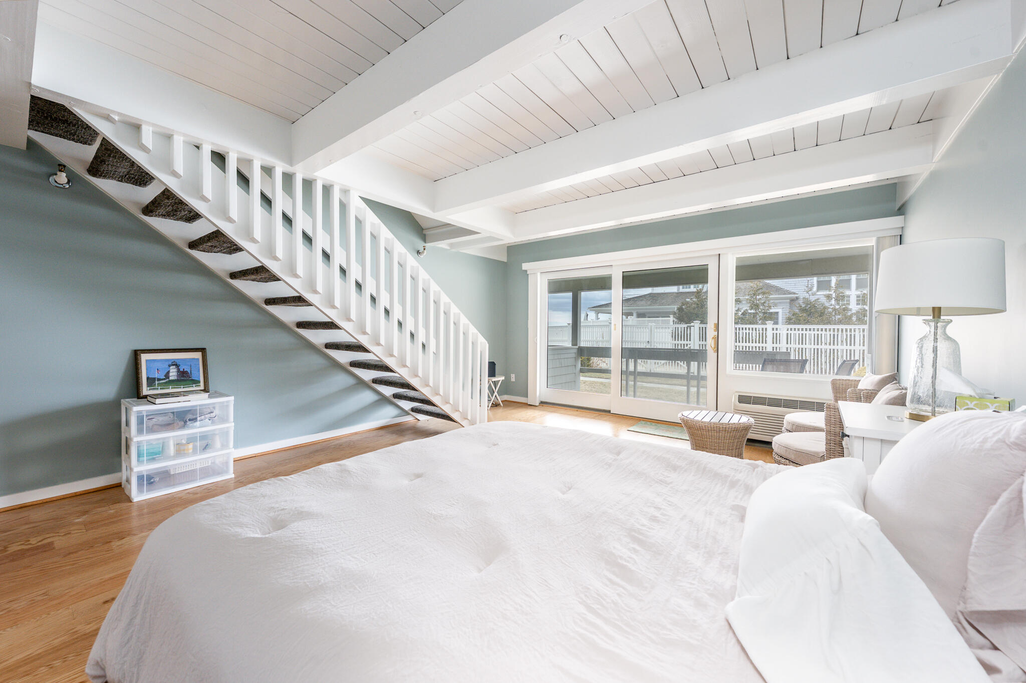 94 Shore Drive West, Unit 9B Mashpee, MA 02649 - Photo 22 of 35 a large white bed sitting in a bedroom next to a window