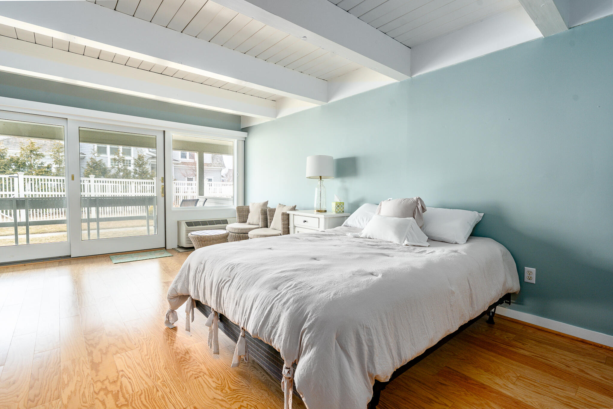 94 Shore Drive West, Unit 9B Mashpee, MA 02649 - Photo 23 of 35 a large bed sitting in a spacious bedroom next to a window