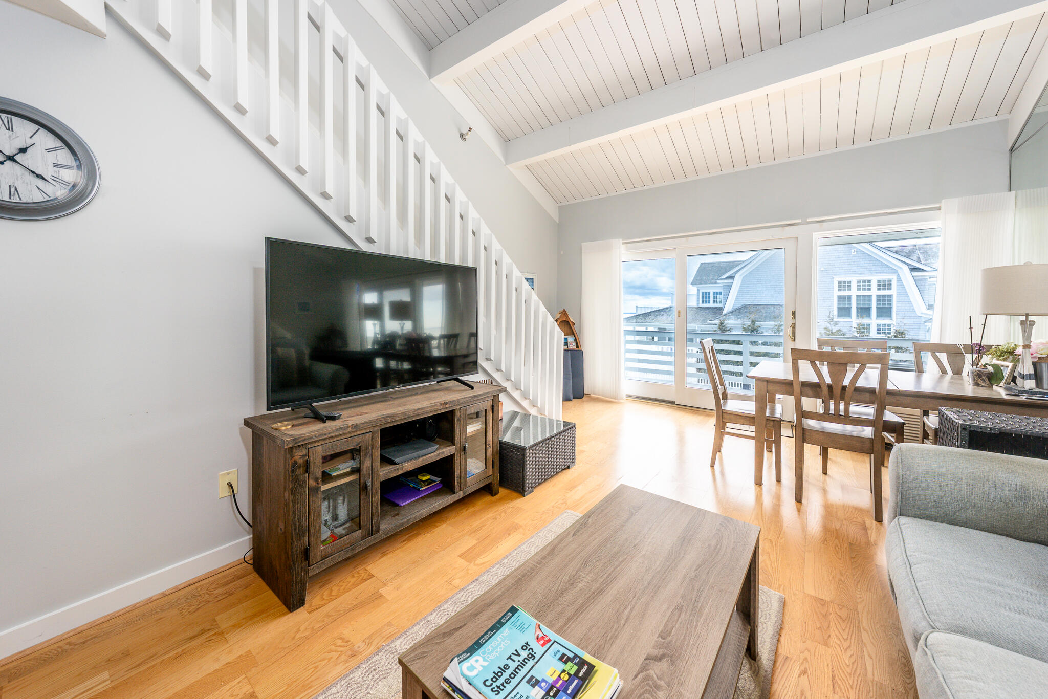 94 Shore Drive West, Unit 9B Mashpee, MA 02649 - Photo 3 of 35 a living room with furniture and a flat screen tv