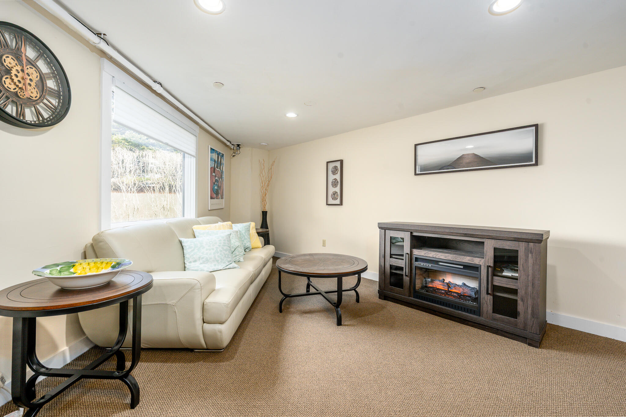 94 Shore Drive West, Unit 9B Mashpee, MA 02649 - Photo 33 of 35 a living room with furniture and a fireplace