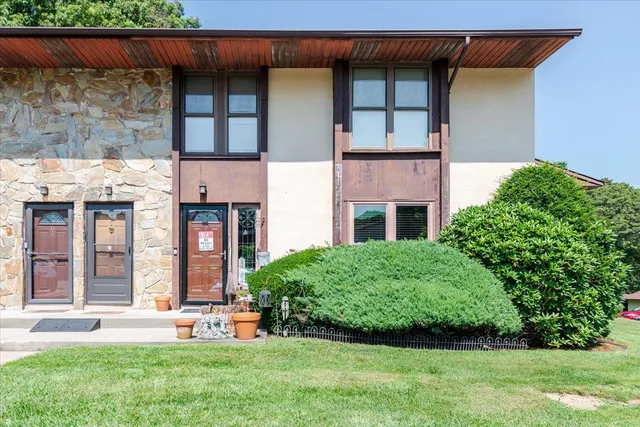 front view of a house with a yard
