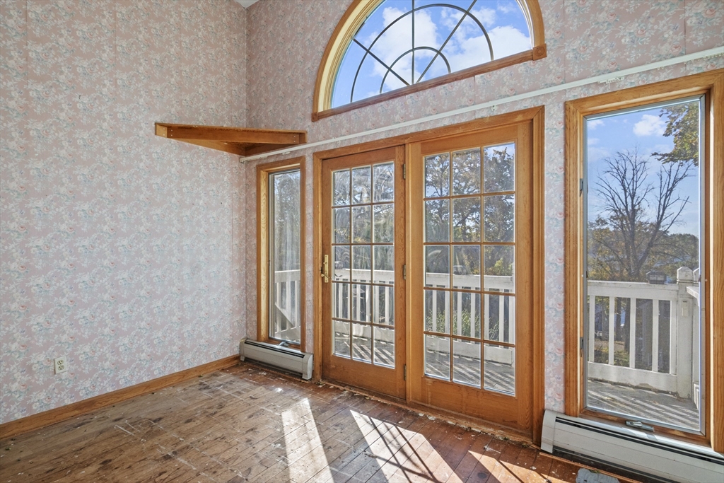 8 Mockingbird Hill Road Amesbury, MA 01913 - Photo 13 of 35 a view of a room that has a large window and bed