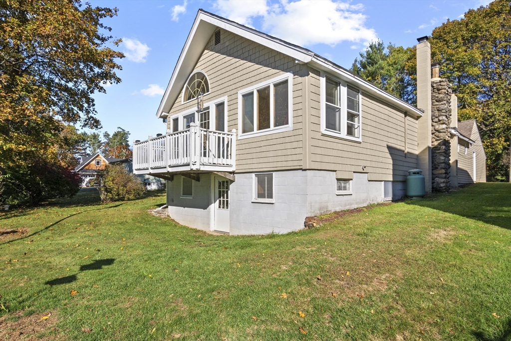 8 Mockingbird Hill Road Amesbury, MA 01913 - Photo 31 of 35 a view of a house with a yard