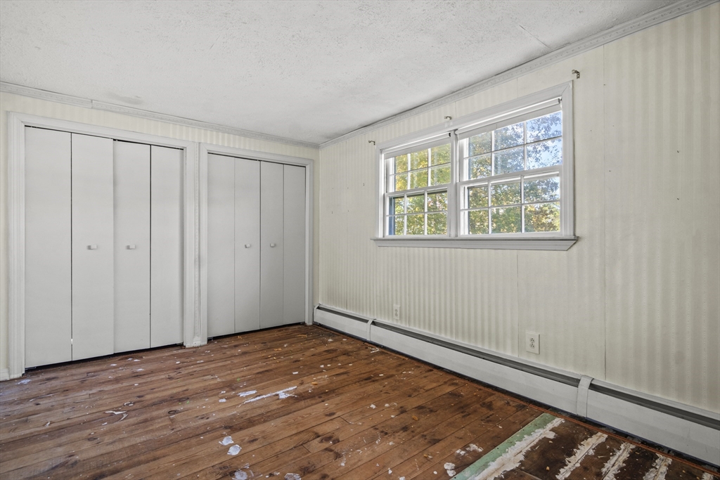 8 Mockingbird Hill Road Amesbury, MA 01913 - Photo 6 of 35 a view of an empty room with wooden floor and a window