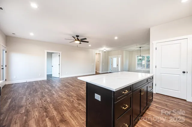 a kitchen with stainless steel appliances a sink dishwasher a stove and microwave