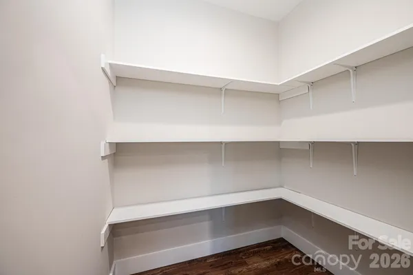 a view of an empty walk in closet
