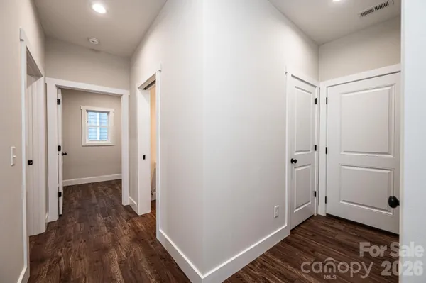 a view of a room with wooden floor