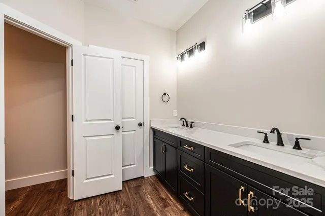 a bathroom with a shower and a glass door