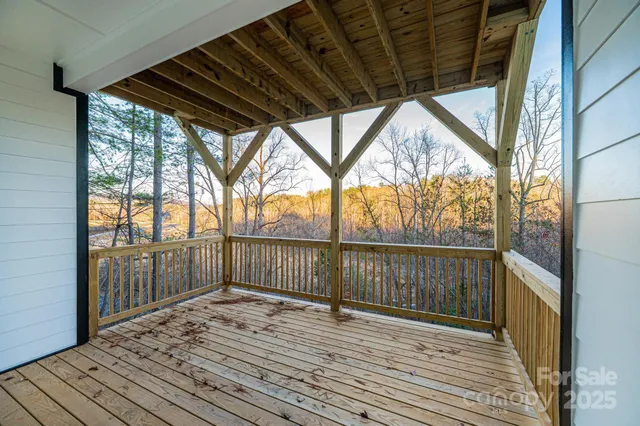 a view of balcony with wooden floor