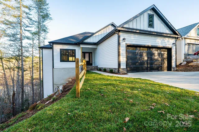 a view of a house with backyard and porch