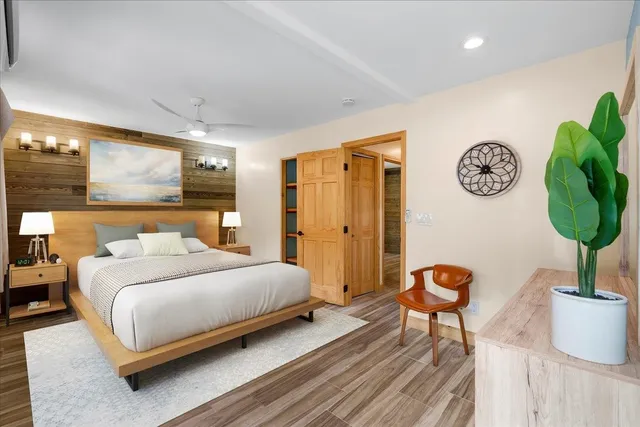 a bedroom with a bed and a table