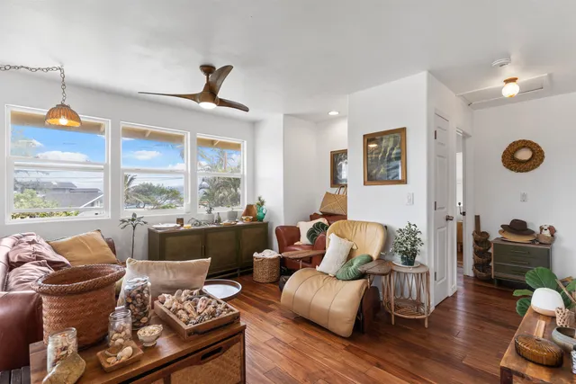 a living room with furniture fireplace and window