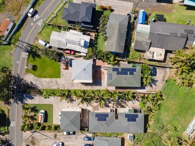 an aerial view of residential houses with outdoor space