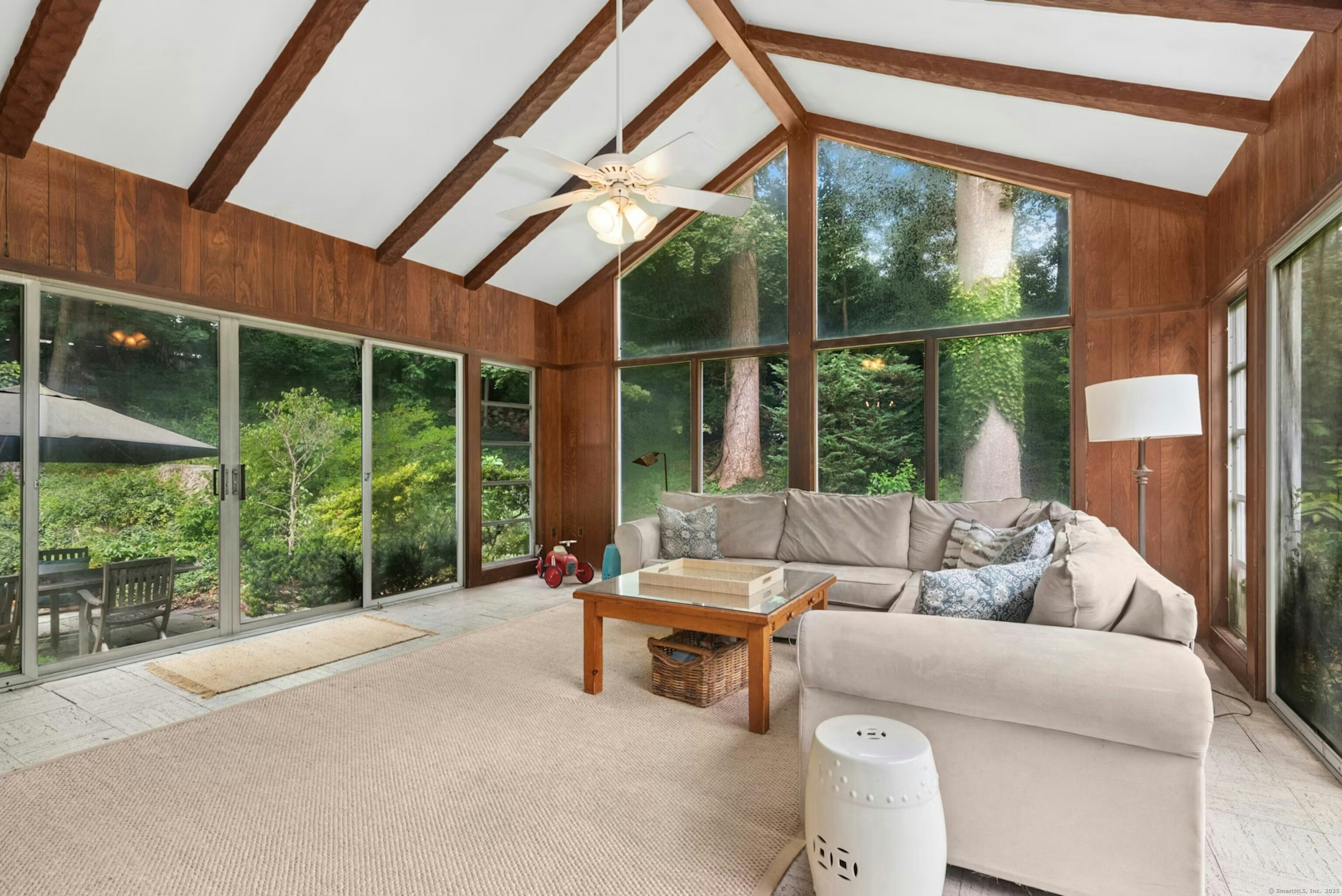 76 Deepwood Road Darien, CT 06820 - Photo 11 of 29 a living room with furniture and a large window