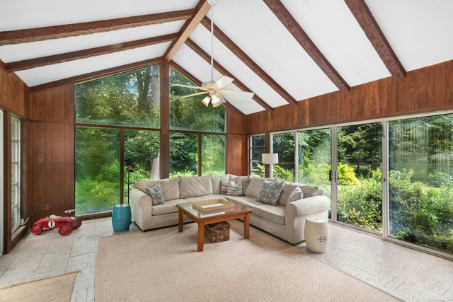 a living room with furniture and a window