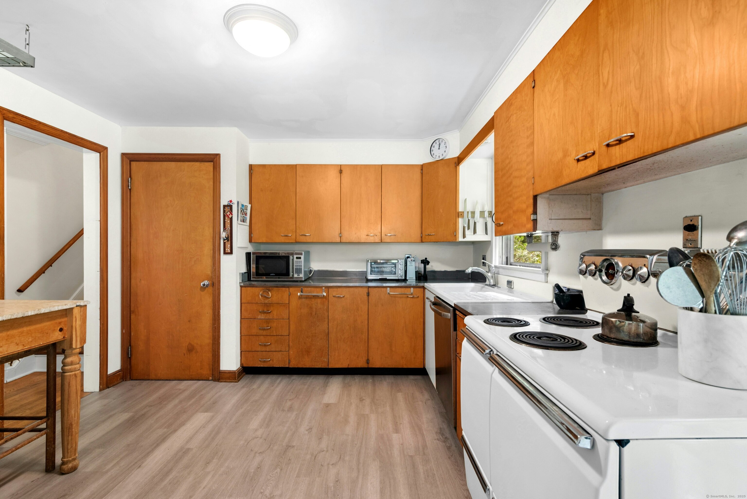 76 Deepwood Road Darien, CT 06820 - Photo 16 of 29 a kitchen with a stove a sink and a refrigerator