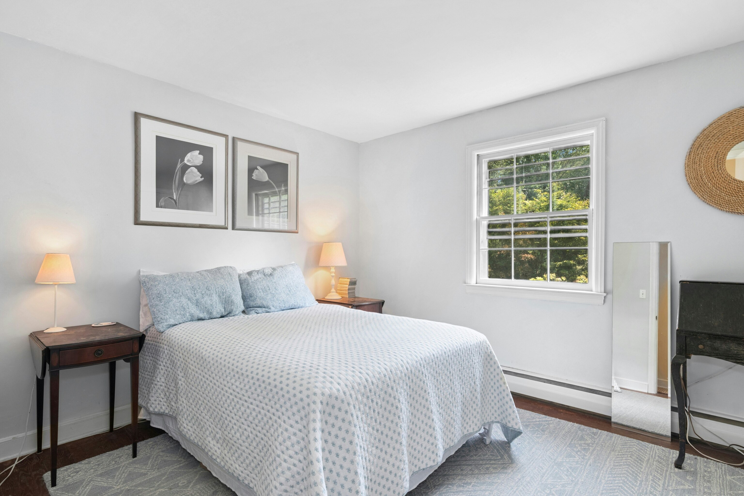 76 Deepwood Road Darien, CT 06820 - Photo 21 of 29 a bedroom with a bed and a tv on dresser