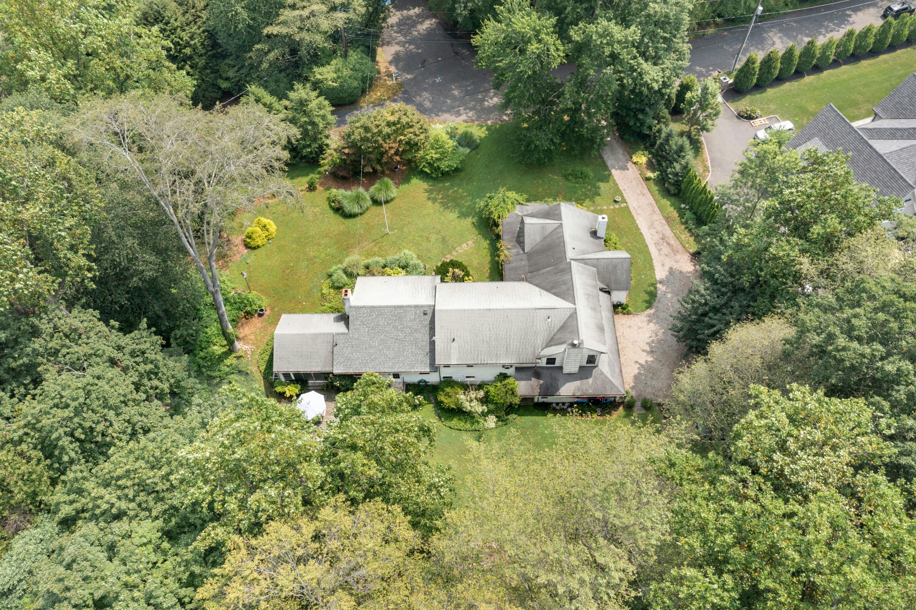 76 Deepwood Road Darien, CT 06820 - Photo 25 of 29 an aerial view of a house with a yard and lake view
