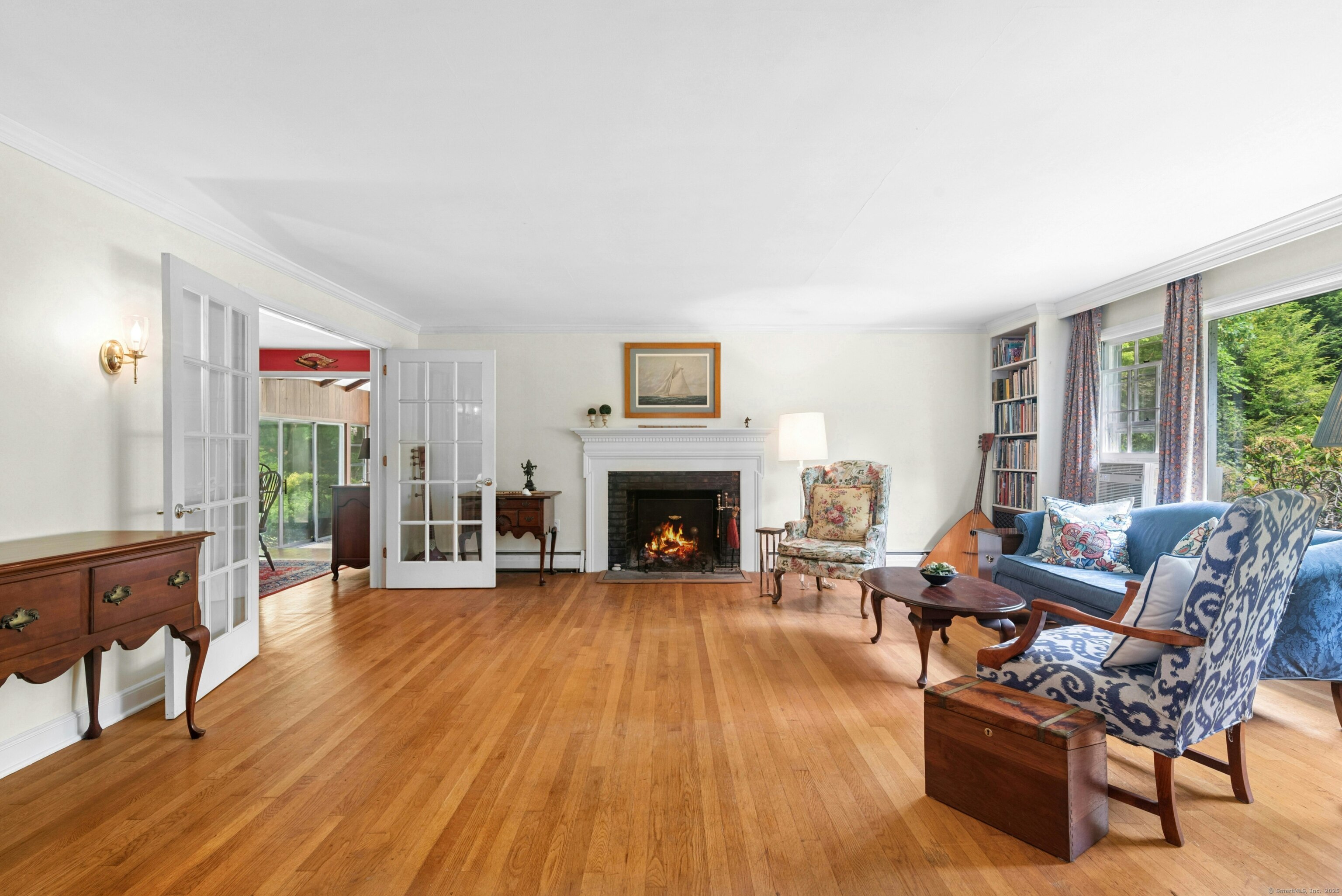 76 Deepwood Road Darien, CT 06820 - Photo 4 of 29 a living room with furniture and a fireplace