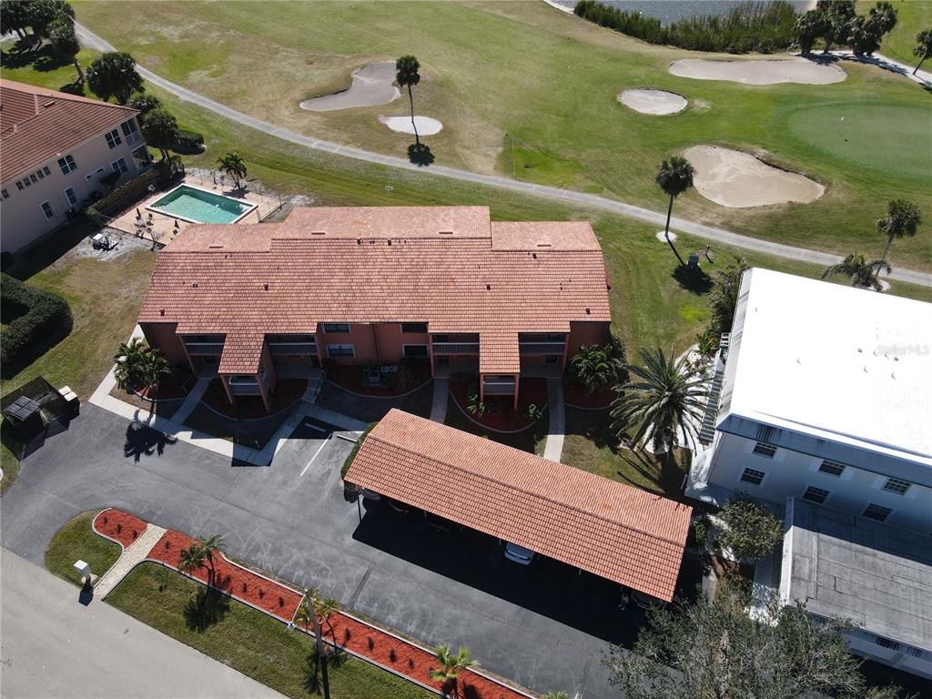 an aerial view of a house with a yard