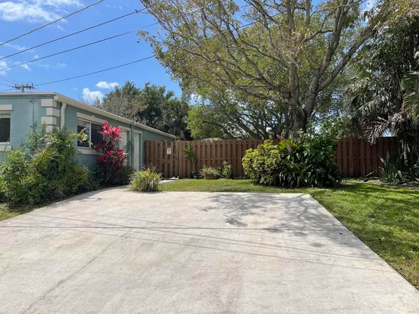 a view of a house with a street