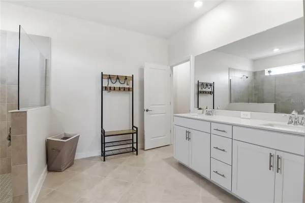 a bathroom with a shower and tub