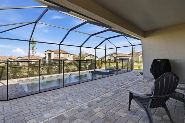 a view of a backyard with a patio and wooden floor
