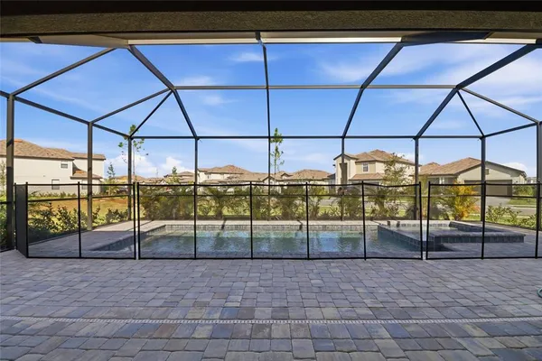 a view of a swimming pool with an outdoor seating