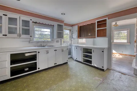 a kitchen with stainless steel appliances granite countertop a stove and a sink