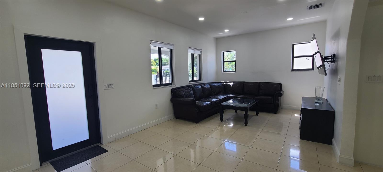 1721 Southwest 24th Terrace Miami, FL 33145 - Photo 6 of 80 a living room with furniture and a window