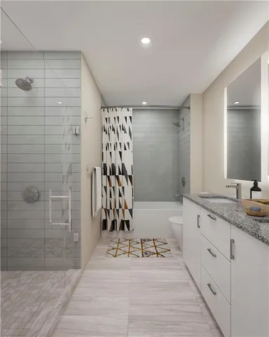 a bathroom with a granite countertop bathtub a sink and a shower