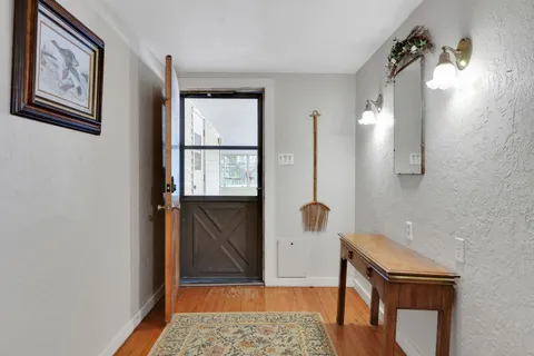 a bathroom with a window and a shower
