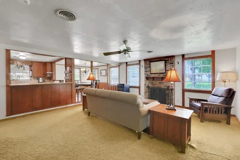 a dining room with furniture and window