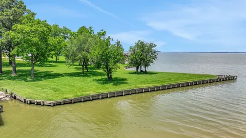 a view of a swimming pool with a yard