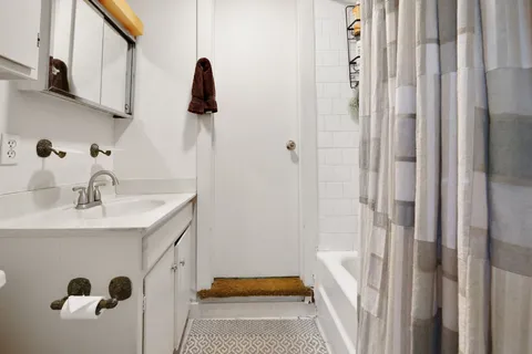 a bedroom with a bed and a walk in closet