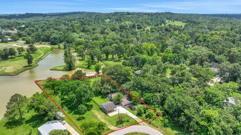 a view of a lake with a yard and mountain