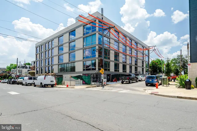 a view of a building with sitting area