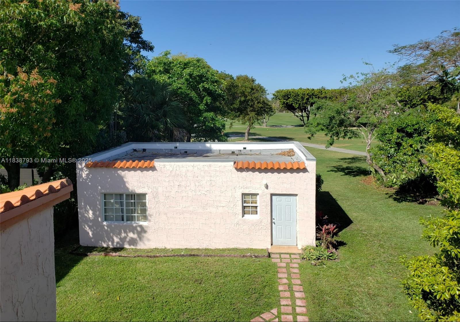 3124 Prairie Avenue Miami Beach, FL 33140 - Photo 11 of 36 a view of a house with a yard