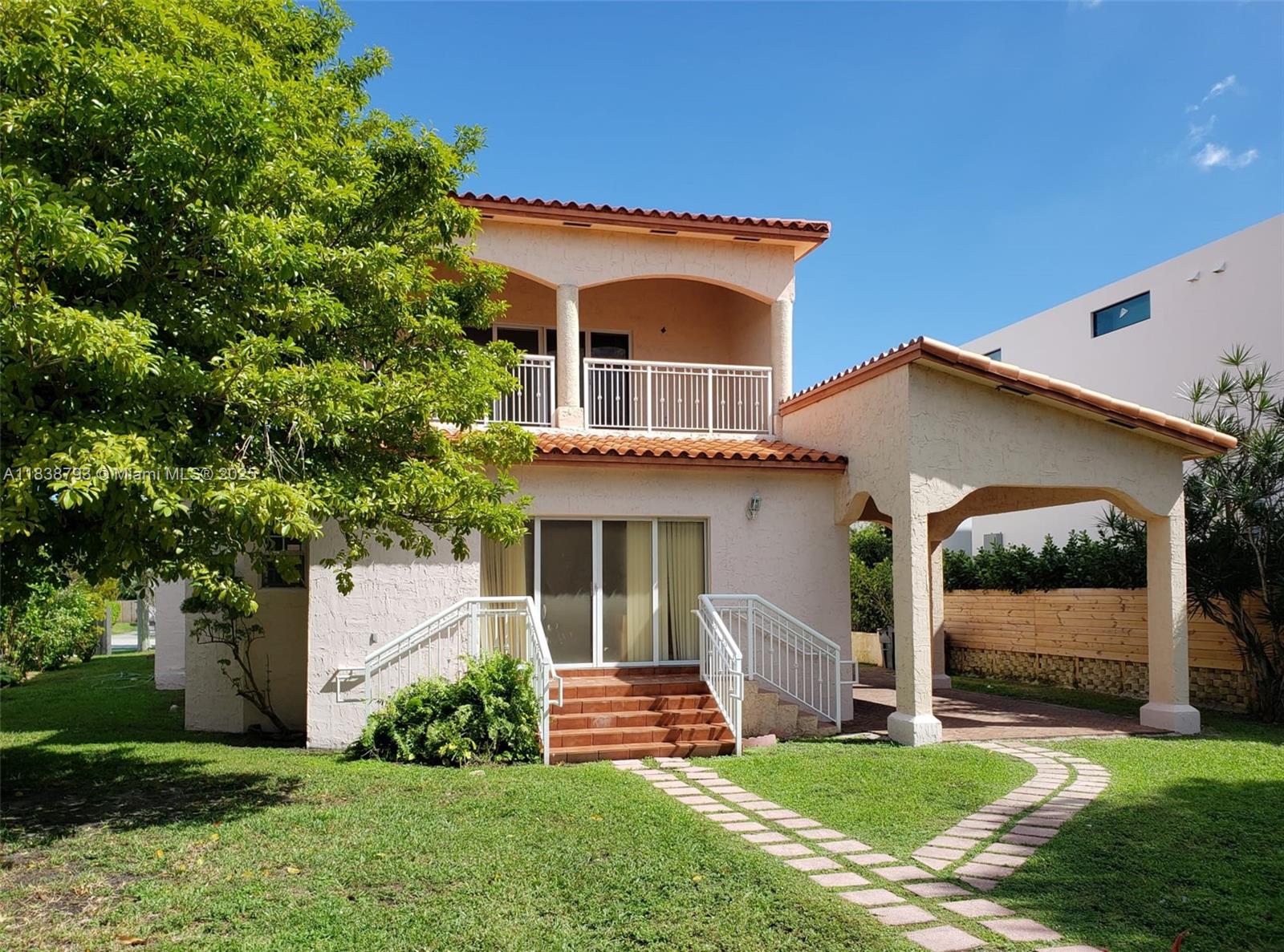 3124 Prairie Avenue Miami Beach, FL 33140 - Photo 5 of 36 a front view of house with yard and green space