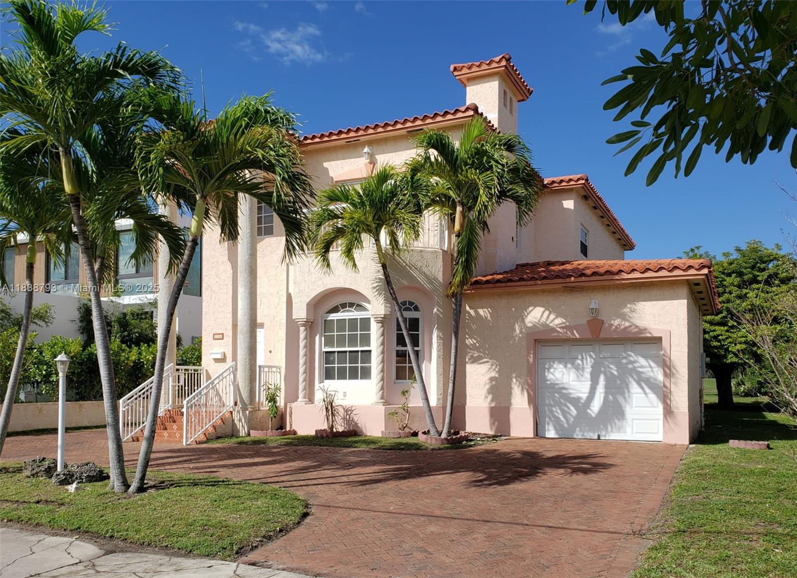 3124 Prairie Avenue Miami Beach, FL 33140 - Photo 6 of 36 a front view of a house with a yard