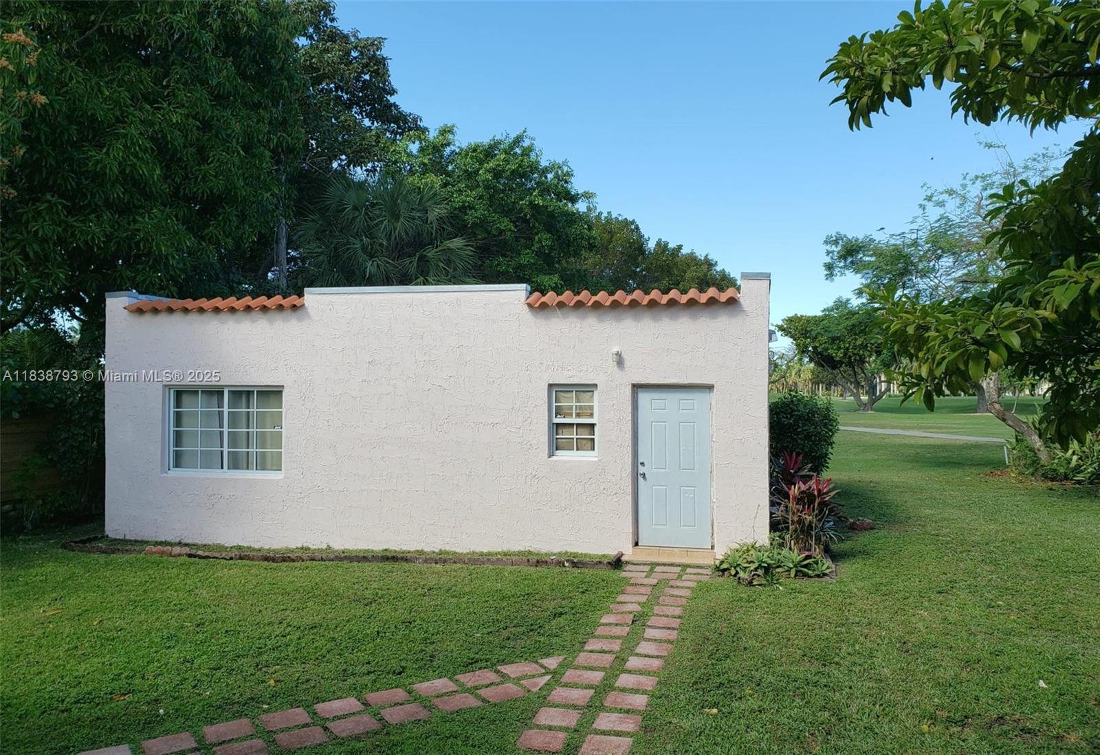 3124 Prairie Avenue Miami Beach, FL 33140 - Photo 9 of 36 a view of a house with a yard