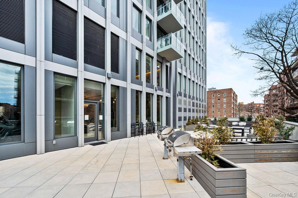 136-18 Maple Avenue, Unit 9A Queens, NY 11355 - Photo 29 of 35 Outdoor landscaped terrace with seating and bbq grills.
