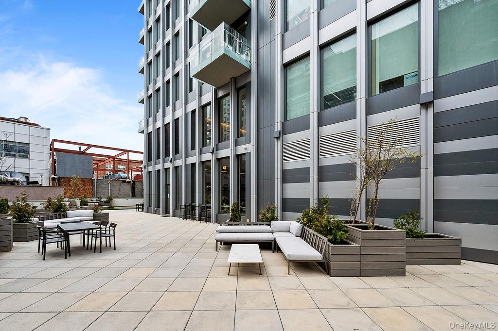 136-18 Maple Avenue, Unit 9A Queens, NY 11355 - Photo 30 of 35 View of patio featuring outdoor dining space