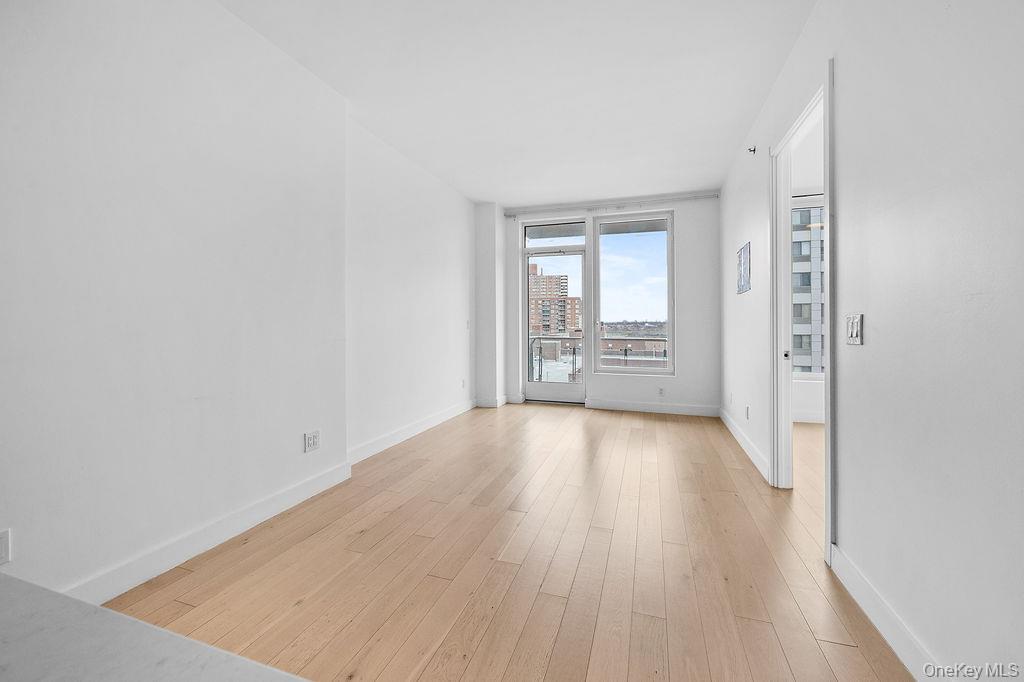 136-18 Maple Avenue, Unit 9A Queens, NY 11355 - Photo 5 of 35 Living room featuring with door to balcony.