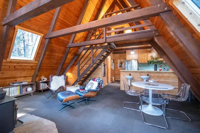 a view of gym with large windows