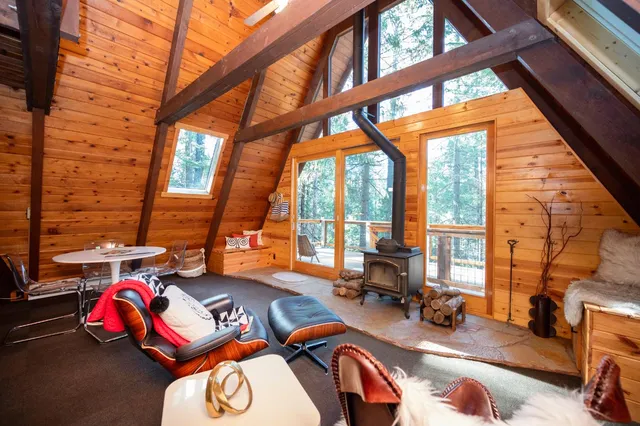 a view of a backyard with a patio and outdoor seating