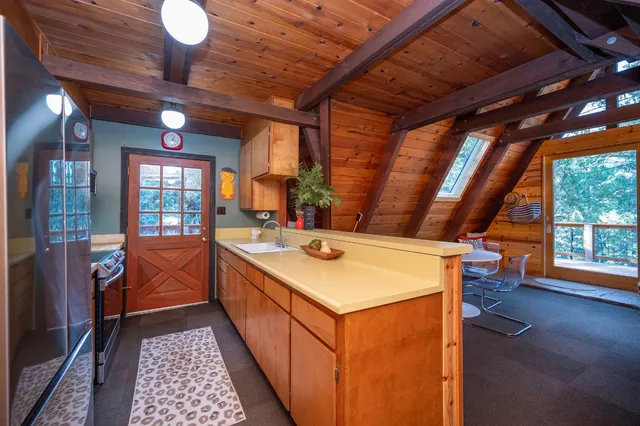 a kitchen with a stove and a microwave