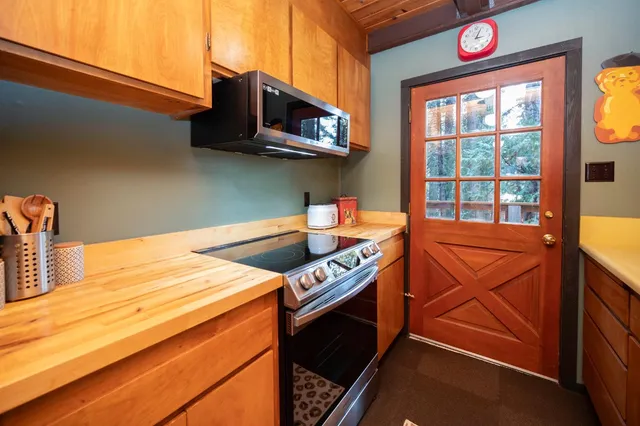 a view of a balcony with wooden floor and outdoor seating