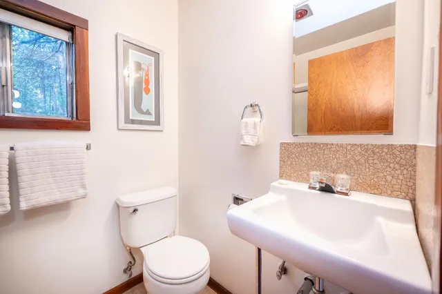 a dining room with furniture and a window